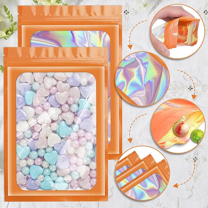 ANZNKU 100 Pcs Smell Proof Mylar Resealable Bags, Holographic Packaging Bags, Resealable Odor Foil Pouch Zip Bag with Clear Window for Food Storage and Lipgloss, Jewelry Lash (Orange, 4.7 x 7.9 Inch)