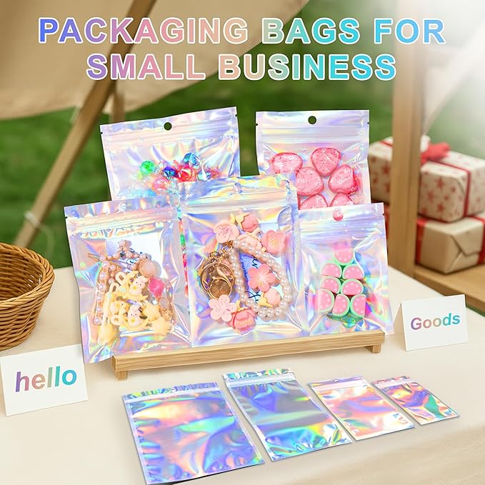 ANZNKU 100 Pack Mylar Bags Reasealable Holographic Bags, Smell Proof Bag Zipper Pouches with Clear Window, Jewelry Candy Sealable Bag for Packaging Sample Party Favor (5.1 x 8.3 Inch)